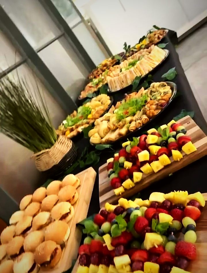 Grazing boards with fruit skewers, rolls and savoury bites